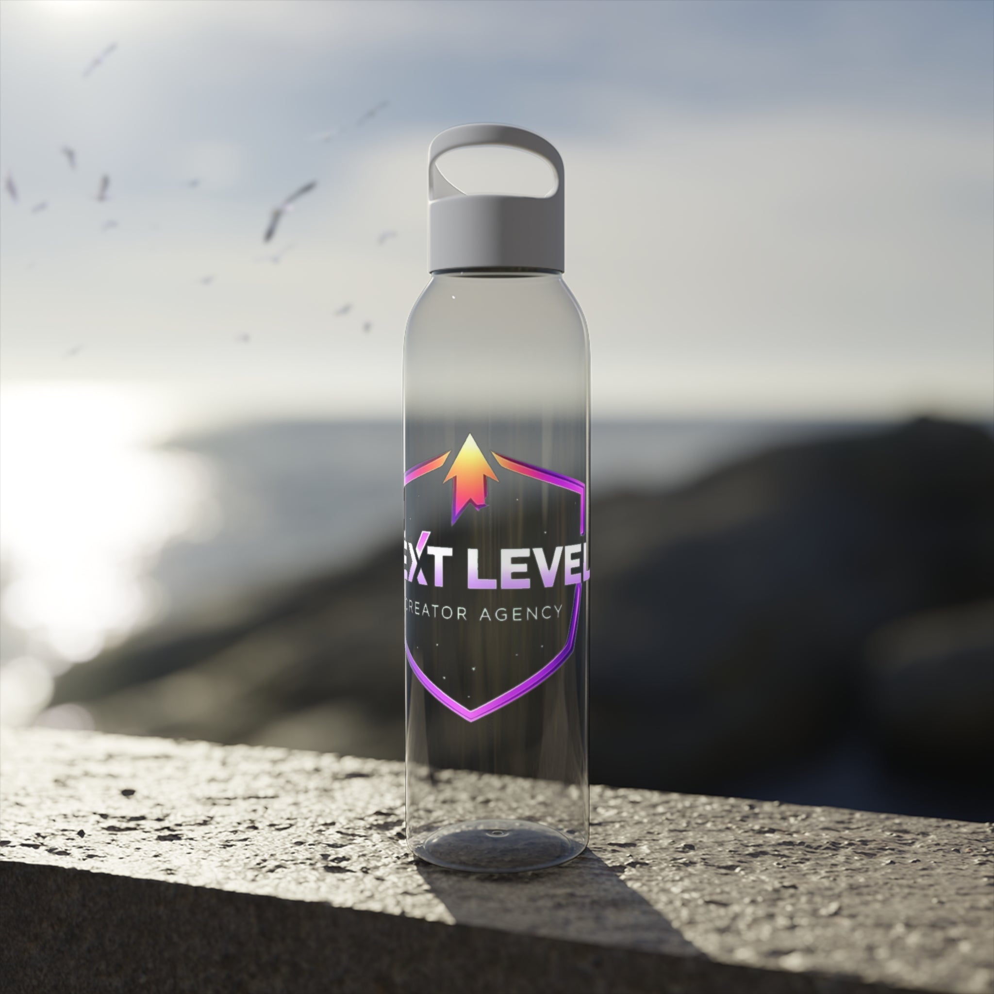 Sky Water Bottle — Clear Bottle with Gradient Arrow Logo (Next Level Creator Agency)